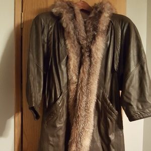 Woman's long leather coat, trimmed in fox.